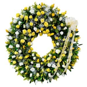 Corona fúnebre de rosas amarillas y blancas